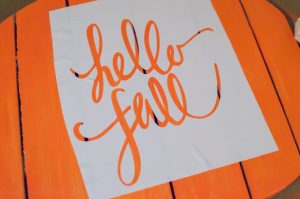 Learn how to easily make a stencil with your Silhouette cutting machine and use it to decorate a Hello Fall wreath to hang on your front door!