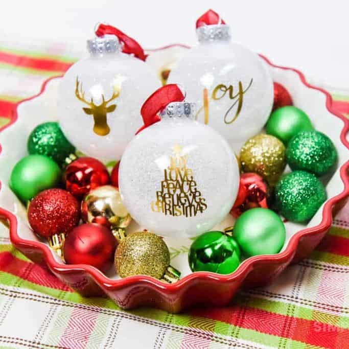 white glitter ornaments with a gold foil design