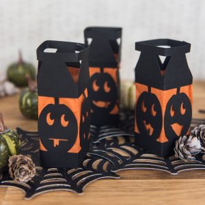 Paper Pumpkin Lanterns - I love lanterns but I hate spending money on them at the store so I decided to make my own mini Halloween paper lanterns instead. They're an easy DIY, cheap, and family friendly. And can be made with a Silhouette or Cricut machine!