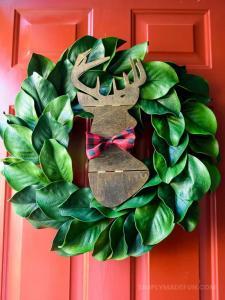 Make the easiest holiday wreath to last through Christmas and beyond! All it takes is a little bit of greenery, wood, and the perfect buffalo plaid ribbon to give your front door a little holiday style.