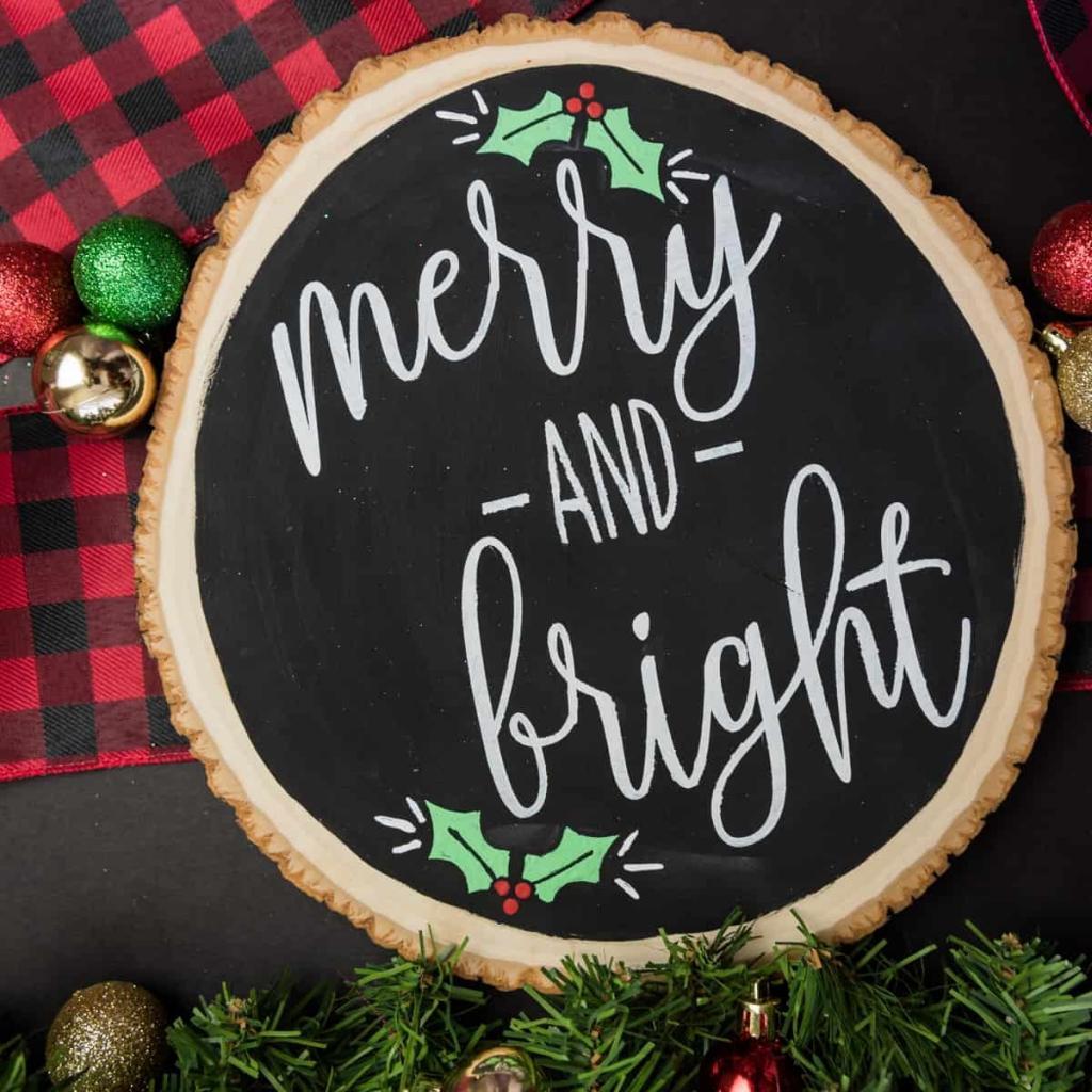 Merry and Bright Christmas Sign - I love saving room and money on Christmas decorations and reversible signs are the perfect way to do both! Using your cutting machine you can repurpose old holiday decor with a new rustic and minimalist design! Free SVG + PNG + DXF file included so you can make one too.