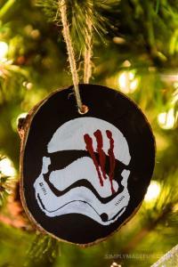 Star Wars Ornaments - Make your own rustic Star Wars Ornaments with wood slices, DecoArt paint, and your Silhouette machine! This simple + quick DIY is perfect for the Star Wars fans in your life!