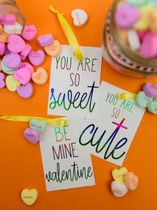 Deco Foil Valentine's Day Tags - I love the look of foil gift tags and never realized how easy it was to do at home! I used my MINC machine and deco foil from Expressions Vinyl to create these candy heart inspired valentines day gift tags!