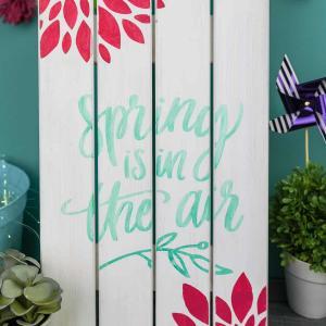 Painted Wooden Spring Sign - Dress up your front porch or your mantle this spring with a bright and colorful wooden sign! Use your Silhouette Cameo to cut out a stencil and pick your favorite paint colors to make this sign your own. It's fun, easy, and you can do it in 20 minutes (or less!).