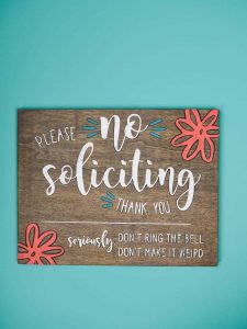 No Soliciting Sign - Who else gets tired of people ringing your doorbell just so they can sell you something? It happens so frequently here and I just wanted it to stop! So I pulled out my Silhouette Cameo and made this no soliciting sign with stencil vinyl and colorful paint in just five easy steps!